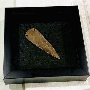 Carved arrow head framed wall art